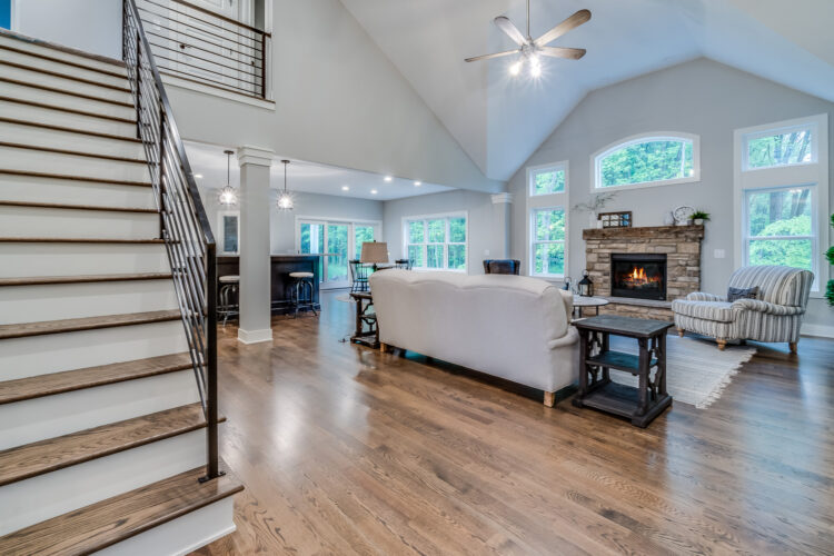 Spacious modern living room remodel with hardwood floors and fireplace