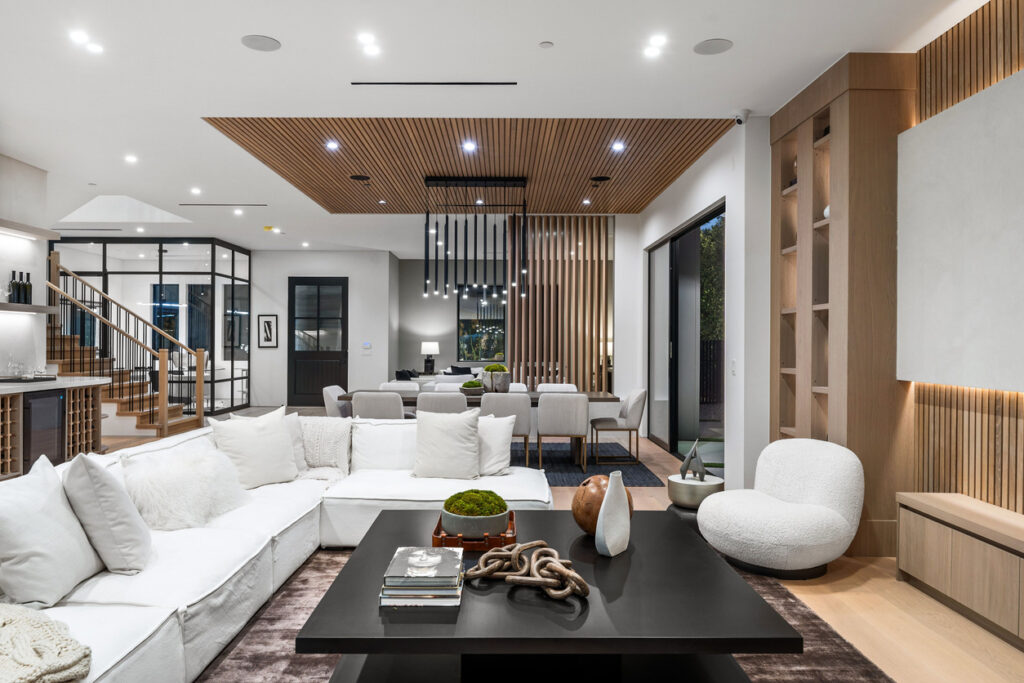 Modern open-concept living room with luxury custom interior finishes