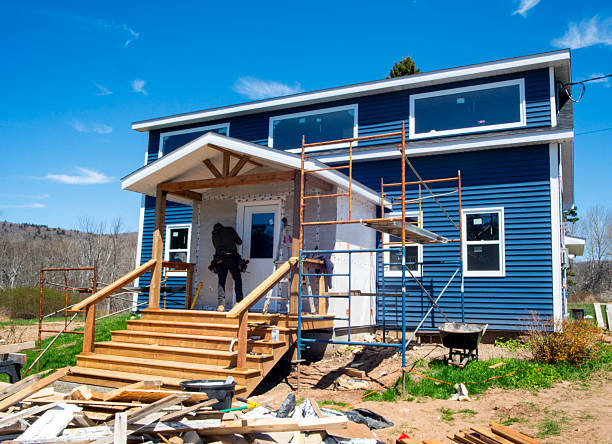 Worker constructing stairs and scaffolding for whole home renovation