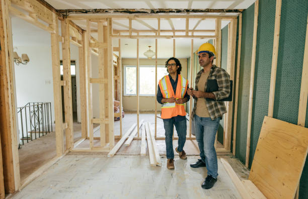Two contractors discussing a home renovation project