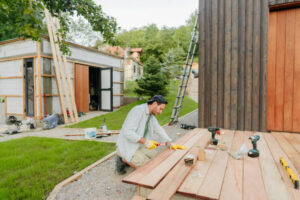 Professional outdoor deck builders working on wooden deck construction