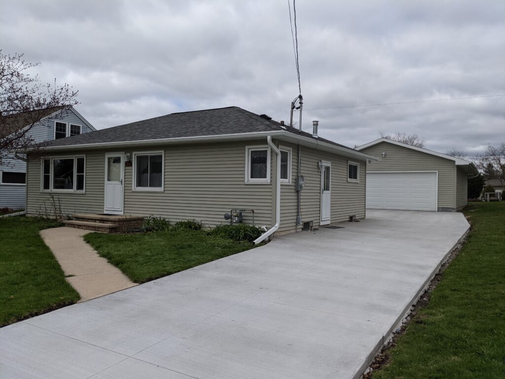 Exterior view of fully renovated home with fresh upgrades